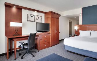 Day use room with work desk and sofa at Courtyard By Marriott Houston NASA/Clear Lake.