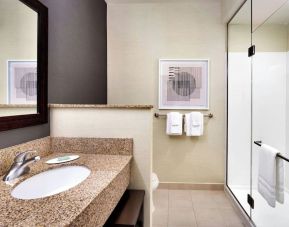 Guest bathroom with shower at Courtyard By Marriott Houston NASA/Clear Lake.