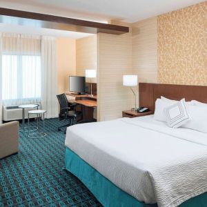 Day use room with work desk and sofa at Fairfield Inn & Suites By Marriott Houston Pasadena.