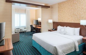 Day use room with work desk and sofa at Fairfield Inn & Suites By Marriott Houston Pasadena.