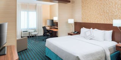 Day use room with work desk and sofa at Fairfield Inn & Suites By Marriott Houston Pasadena.