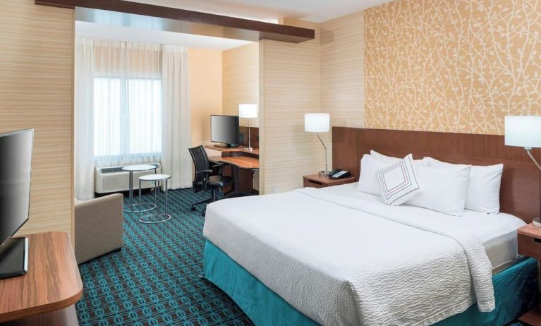 Day use room with work desk and sofa at Fairfield Inn & Suites By Marriott Houston Pasadena.