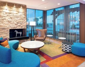 Lobby and coworking lounge at Fairfield Inn & Suites By Marriott Houston Pasadena.