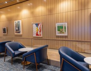 Seats available in front of the Orlando Storytelling Wall at Plaza Premium Lounge. Terminal C (MCO).