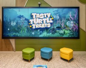 Entertainment space with eco-friendly toys and educational games for young children and toddlers available at Plaza Premium Lounge. Terminal C (MCO).