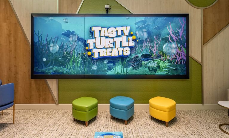 Entertainment space with eco-friendly toys and educational games for young children and toddlers available at Plaza Premium Lounge. Terminal C (MCO).