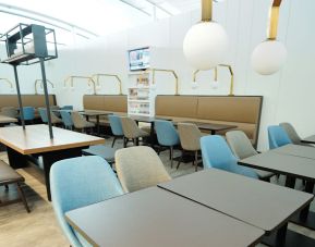 Ample seats with natural light perfect for coworking at Plaza Premium Lounge. Terminal 1 (YYZ).
