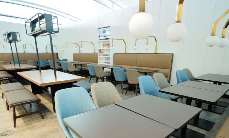 Ample seats with natural light perfect for coworking at Plaza Premium Lounge. Terminal 1 (YYZ).
