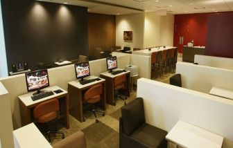 Ample seats and business center available perfect for coworking at Plaza Premium Lounge - Terminal 1 (YYZ).