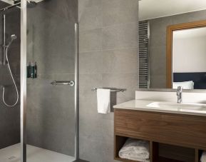 Guest bathroom with shower at Hilton Garden Inn Padova City Centre.