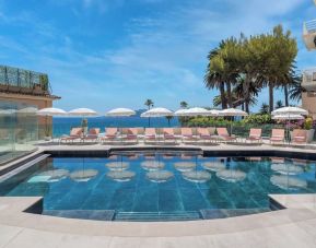 Outdoor pool area at Canopy By Hilton Cannes.