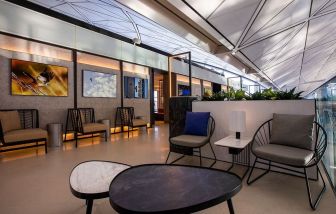 Comfortable seating and workspace at Plaza Premium Lounge, Near Gate 60 - Terminal 1 (HKG).