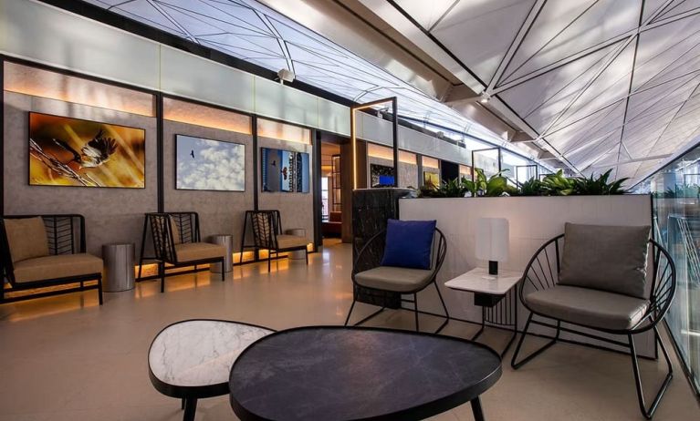 Comfortable seating and workspace at Plaza Premium Lounge, Near Gate 60 - Terminal 1 (HKG).