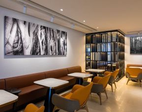 Dining area with comfortable seating at Plaza Premium Lounge, Near Gate 60 - Terminal 1 (HKG).