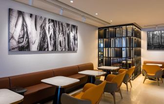 Dining area with comfortable seating at Plaza Premium Lounge, Near Gate 60 - Terminal 1 (HKG).