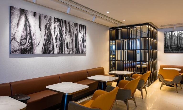 Dining area with comfortable seating at Plaza Premium Lounge, Near Gate 60 - Terminal 1 (HKG).