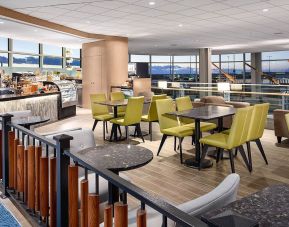 Dining area perfect for coworking at Plaza Premium Lounge, Domestic Gate C29 (YVR).