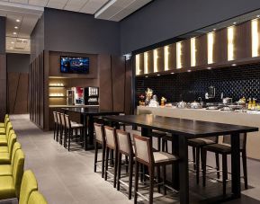 Dining area and workspace at Plaza Premium Lounge, Domestic Gate B15 (YVR).