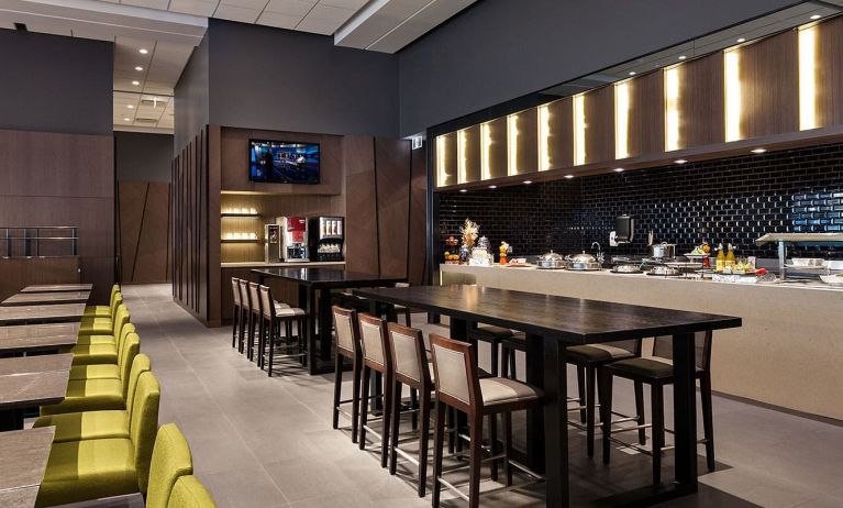 Dining area and workspace at Plaza Premium Lounge, Domestic Gate B15 (YVR).