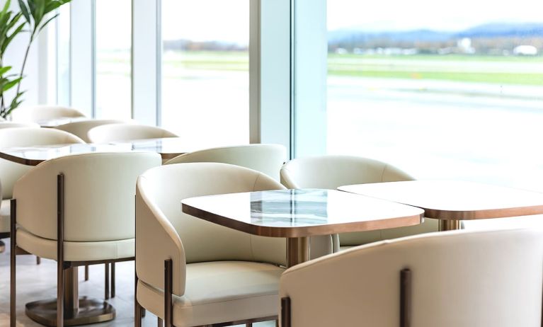 Ample seats with natural light perfect for coworking at Plaza Premium Lounge (YVR).