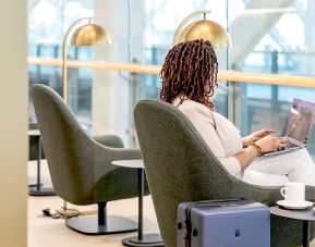 Ample seats with natural light perfect for coworking at Plaza Premium Lounge (YVR).