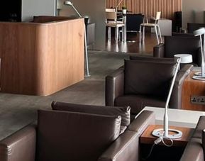 Ample seats with natural light perfect for coworking at Blush Lounge By Plaza Premium Group, Departures (LHR).