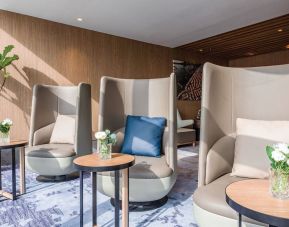 Ample seats with natural light perfect for coworking at Plaza Premium Lounge, Near Gate 35 - Terminal 1 (HKG).