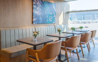 Ample seats with natural light perfect for coworking at Plaza Premium Lounge, Near Gate 35 - Terminal 1 (HKG).