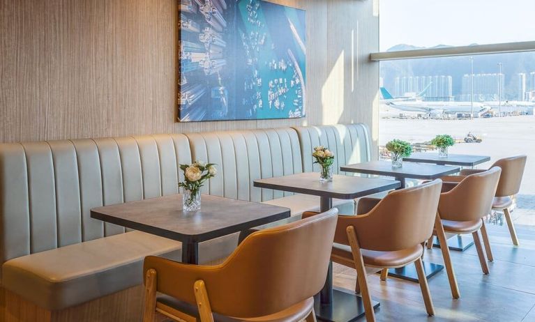 Ample seats with natural light perfect for coworking at Plaza Premium Lounge, Near Gate 35 - Terminal 1 (HKG).