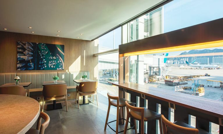 Ample seats with natural light perfect for coworking at Plaza Premium Lounge, Near Gate 35 - Terminal 1 (HKG).