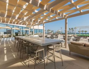 Outdoor seating at Hilton Skanes Monastir Beach Resort.