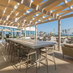 Outdoor seating at Hilton Skanes Monastir Beach Resort.