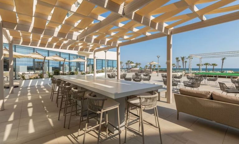 Outdoor seating at Hilton Skanes Monastir Beach Resort.