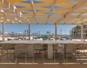 Outdoor bar area at Hilton Skanes Monastir Beach Resort.