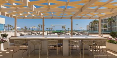 Outdoor bar area at Hilton Skanes Monastir Beach Resort.