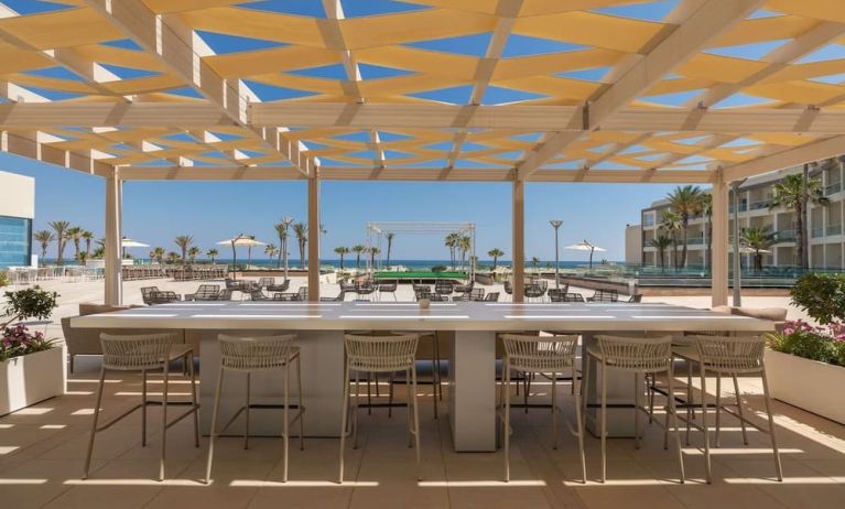 Outdoor bar area at Hilton Skanes Monastir Beach Resort.