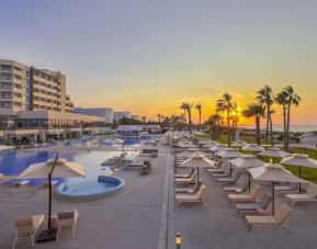 Pool at sunset at Hilton Skanes Monastir Beach Resort.