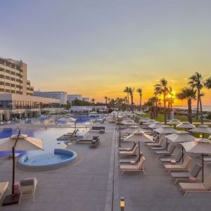 Pool at sunset at Hilton Skanes Monastir Beach Resort.