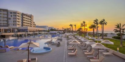 Pool at sunset at Hilton Skanes Monastir Beach Resort.