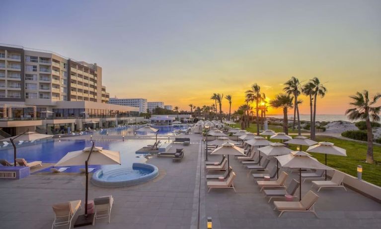 Pool at sunset at Hilton Skanes Monastir Beach Resort.