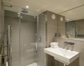 Private guest bathroom with shower at The Lodge - Putney Hotel.