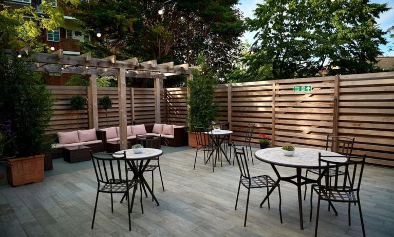 Terrace with seating area, perfect for coworking at The Lodge - Putney Hotel.