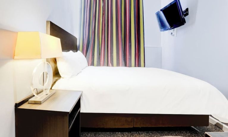 Day use room with TV screen and private bathroom at London Shelton Hotel.