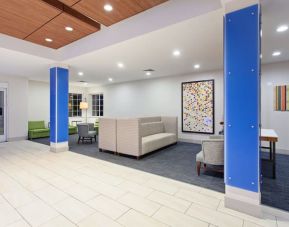 Lobby and coworking lounge at Holiday Inn Express & Suites Corona.