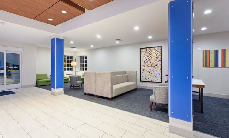 Lobby and coworking lounge at Holiday Inn Express & Suites Corona.