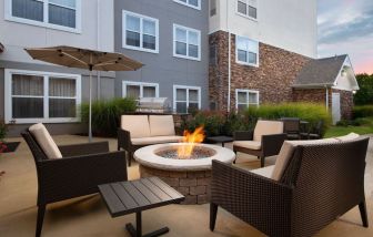 Firepit and outdoor furniture at Residence Inn By Marriott Bentonville Rogers.