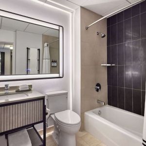 Guest bathroom with shower and tub at Hyatt Regency Chicago.