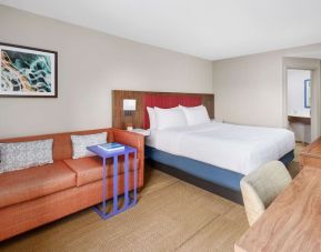 Day use room with work desk and sofa at Hampton Inn By Hilton Fort Lauderdale-Cypress Creek.