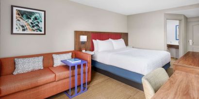 Day use room with work desk and sofa at Hampton Inn By Hilton Fort Lauderdale-Cypress Creek.