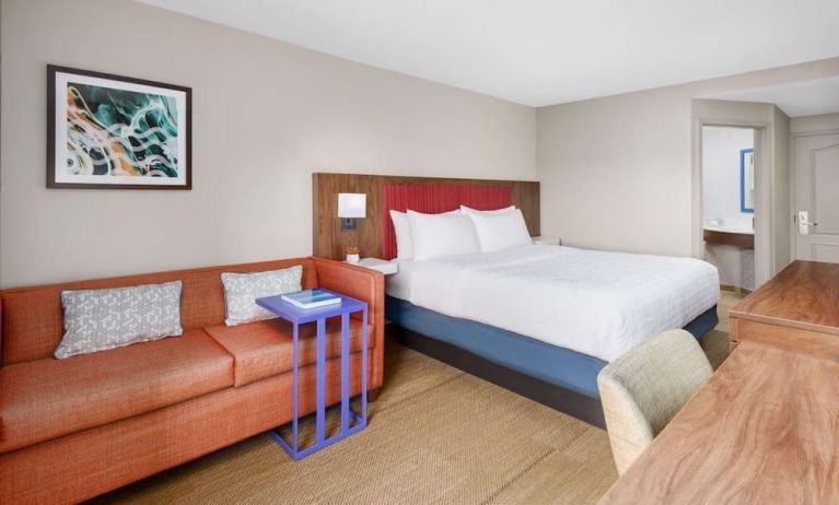 Day use room with work desk and sofa at Hampton Inn By Hilton Fort Lauderdale-Cypress Creek.